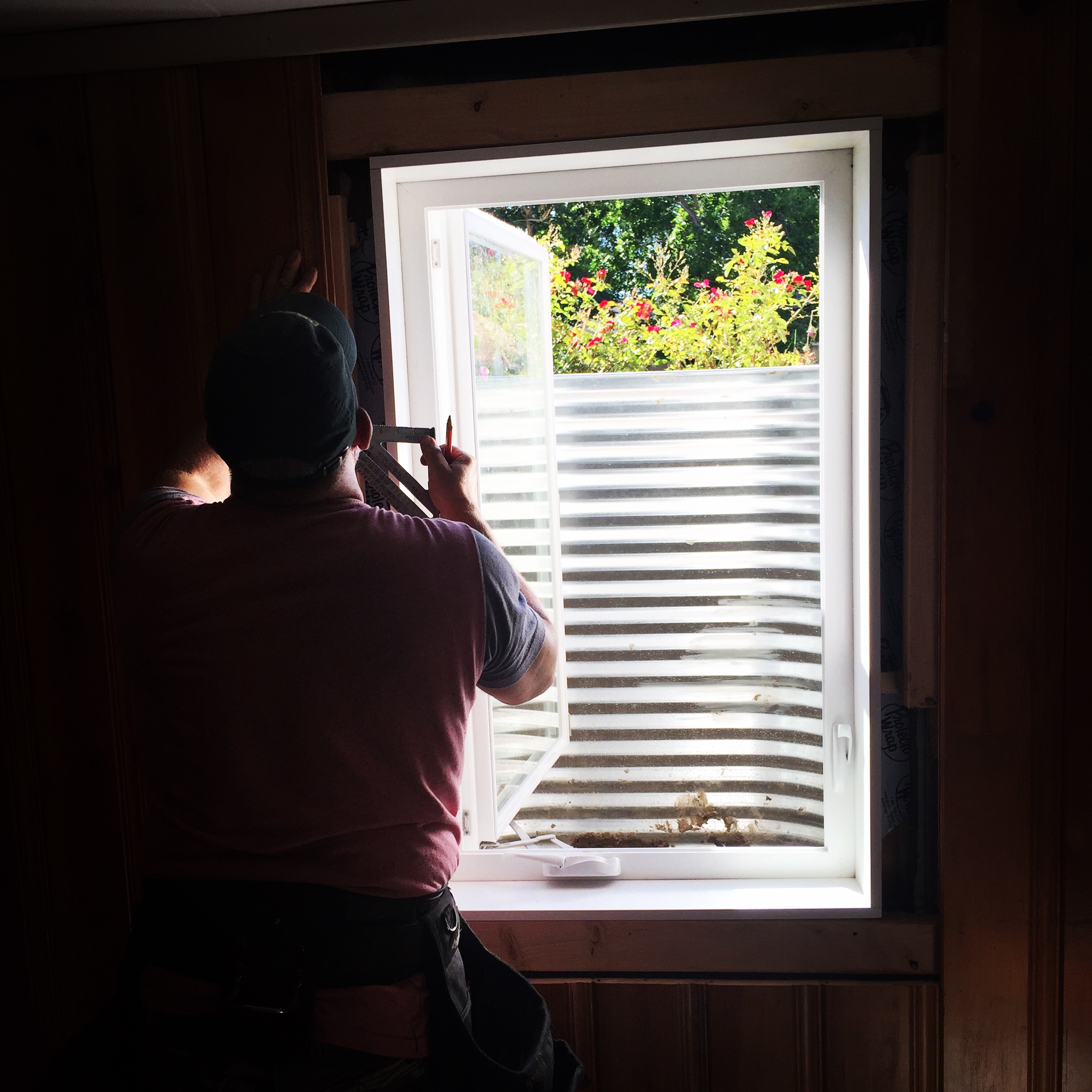 919EEADF-6E6A-4553-BE60-767E692C9726 Window Well Replacements at a basement window while checking drainage depth